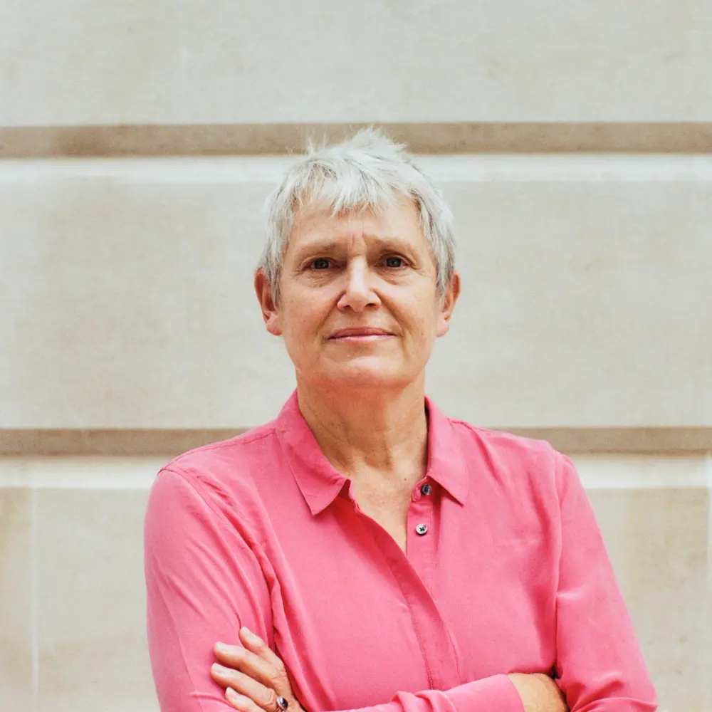 Headshot of Dame Kate Bingham standing outside a building