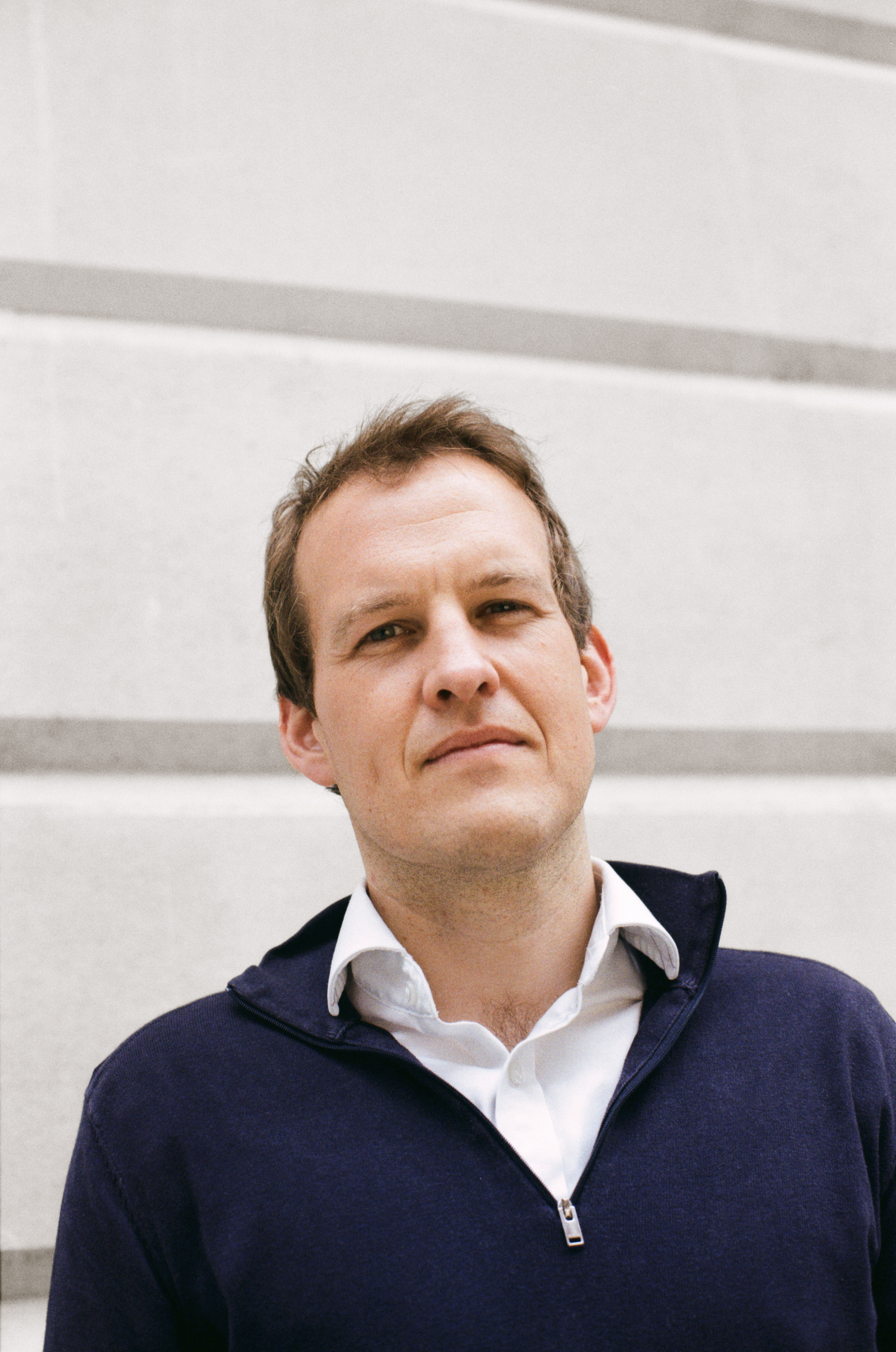 Headshot of Matt Clifford standing outside a building