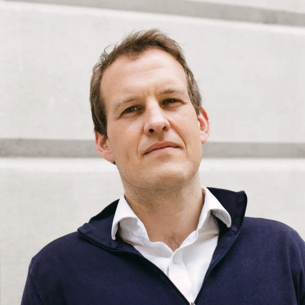 Headshot of Matt Clifford standing outside a building