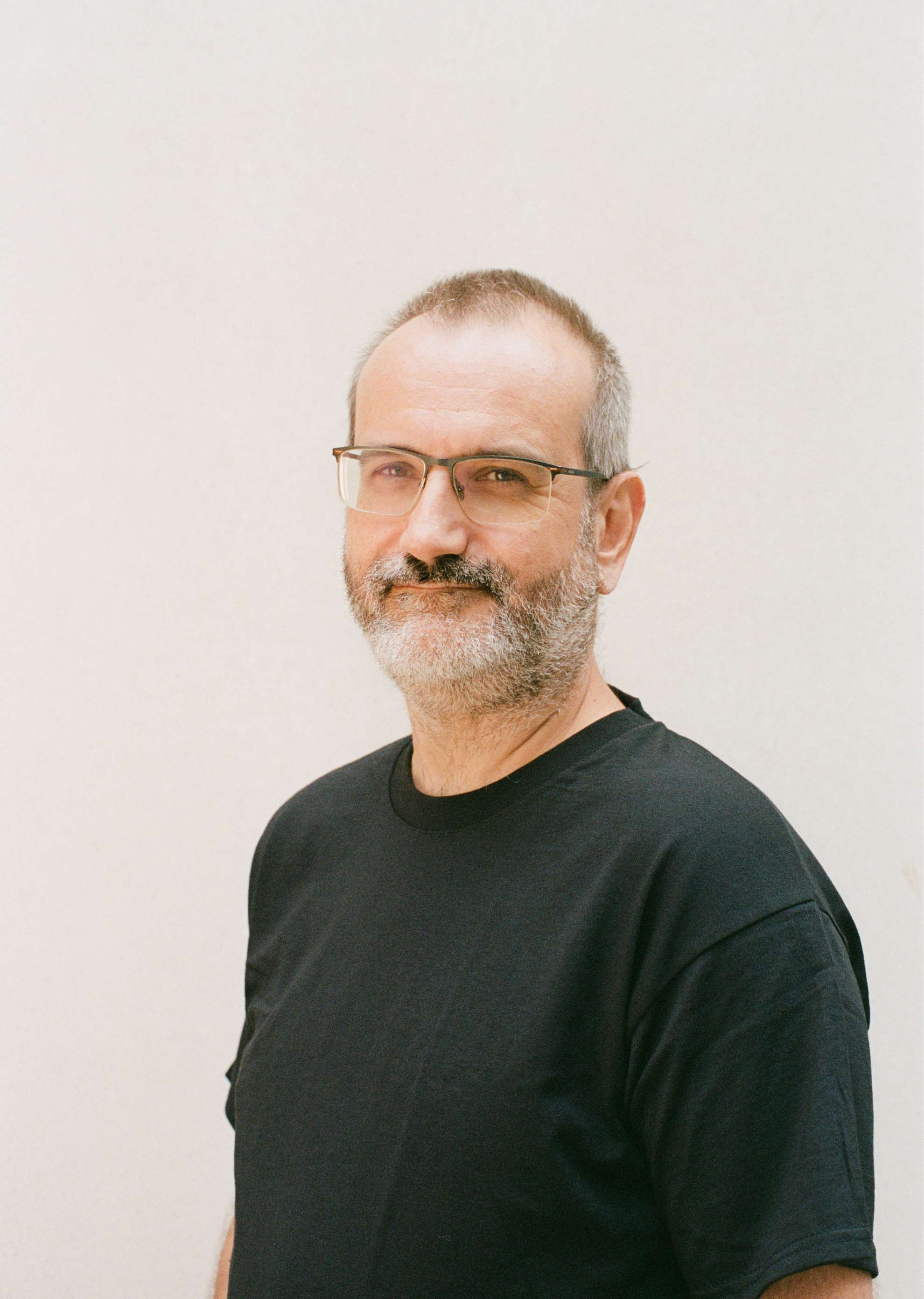 Photo of Ant Rowstron against a cream background