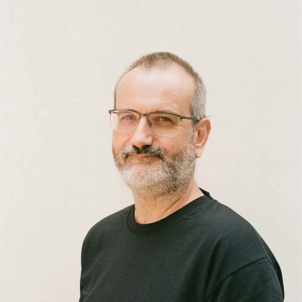 Photo of Ant Rowstron against a cream background